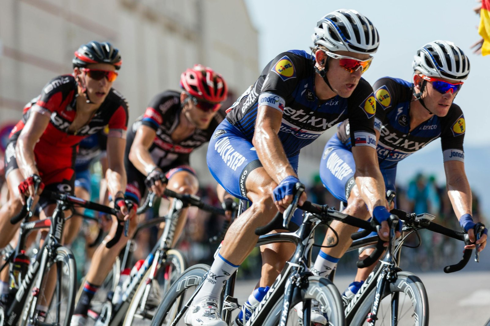Competitive cyclists showcasing athleticism and teamwork and vessent system acting in concert with others.